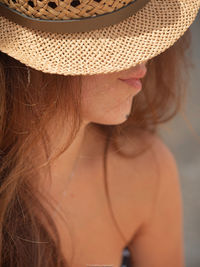 Close-up of woman wearing hat