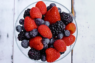 High angle view of strawberries in bowl on table