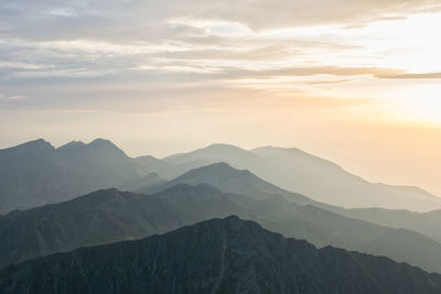 Scenic view of mountains against sky during sunset