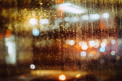 Close-up of wet glass window in rainy season