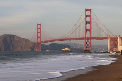 Golden gate bridge over bay against sky