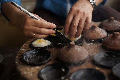 Midsection of person preparing food