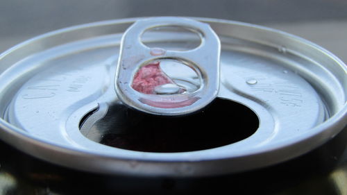 High angle view of drink can on retaining wall