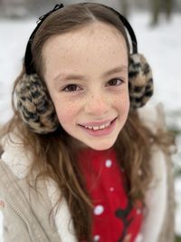 Portrait of cute smiling girl during winter