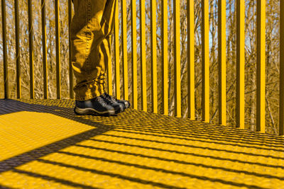 Low section of person on metal floor