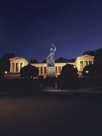 Buildings in city at night
