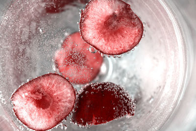 High angle view of strawberries on glass