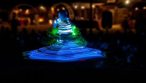 Close-up of multi colored glass on illuminated table