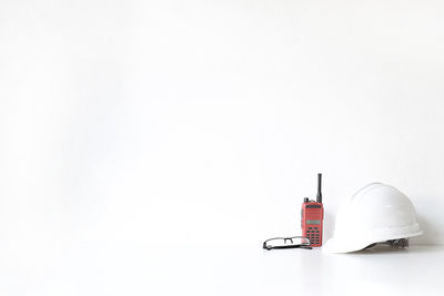 Close-up of pen on table against white background