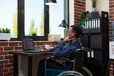 Disabled businessman working in office