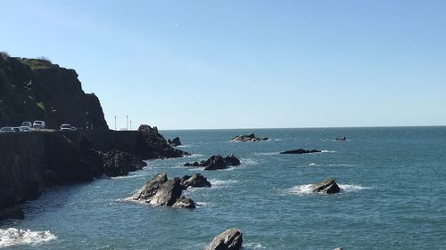 Scenic view of sea against clear blue sky