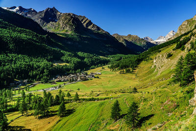 Scenic view of landscape and mountains against sky