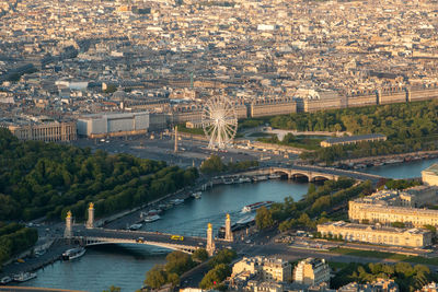 High angle view of bridge over river amidst buildings in city