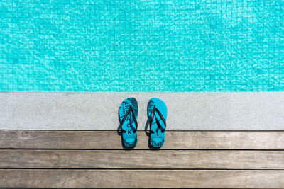 High angle view of shoes on swimming pool