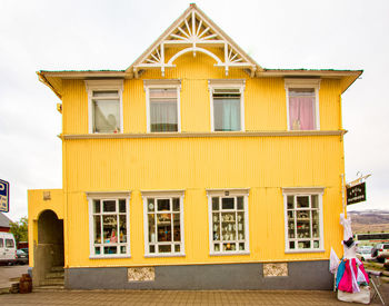 Exterior of yellow building against sky