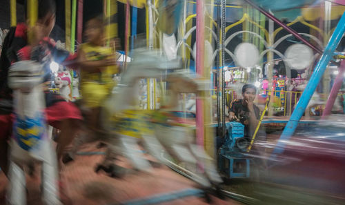 Blurred motion of people walking in city