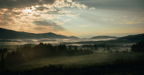 Scenic view of landscape against sky during sunset