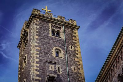 Low angle view of bell tower against sky