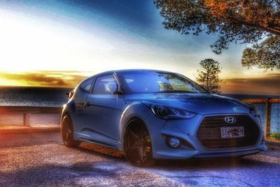 Vintage car against sky during sunset