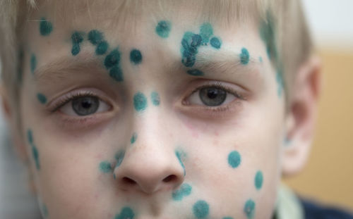 Close-up of a boy with painted face