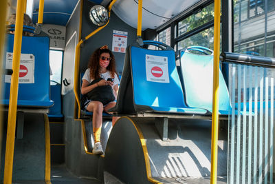 Portrait of woman sitting in bus