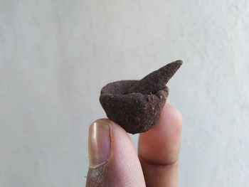 Close-up of hand holding ice cream