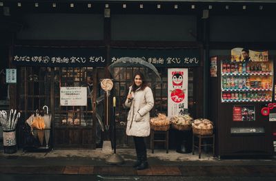 Portrait of man standing at store