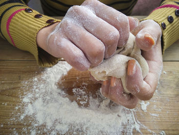 High angle view of person preparing food on table