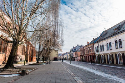 View of street amidst buildings in city