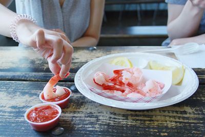 Close-up of cropped hand holding ice cream