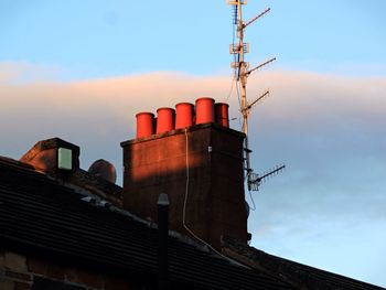 Low angle view of building against sky during sunset