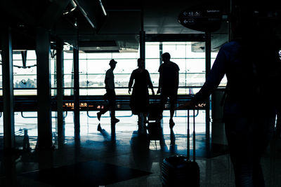 Silhouette people at airport