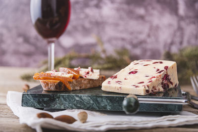 A slice of british wensleydale and cranberry cheese.