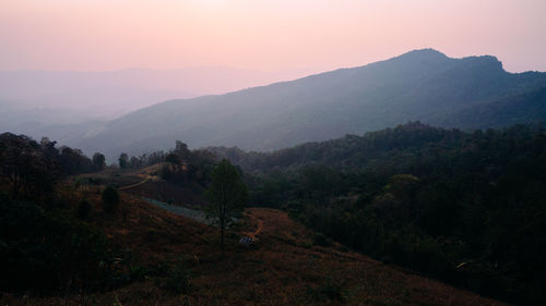 High angle view of mountains against sky during sunset