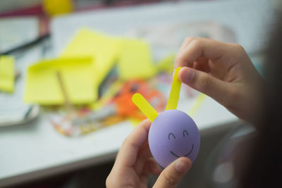 Cropped image of girl making easter bunny