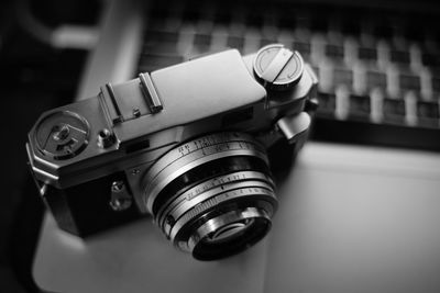 Close-up of camera on table