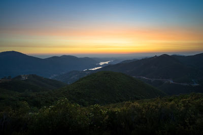 Scenic view of mountains against sky during sunset