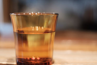 Close-up of coffee in glass on table