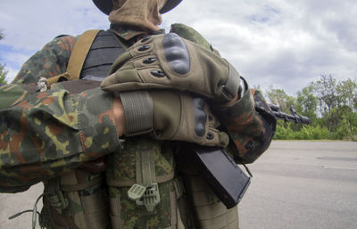 Rear view of man standing at zoo