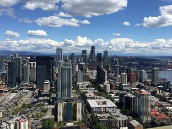 High angle view of modern buildings in city against sky