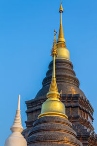 Low angle view of pagoda against blue sky