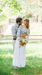 Young couple standing on grass