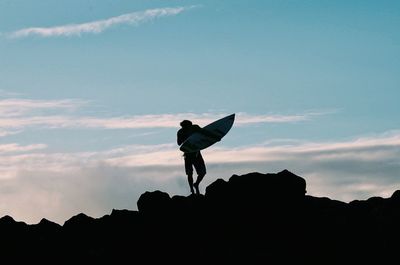 Low angle view of woman against sky