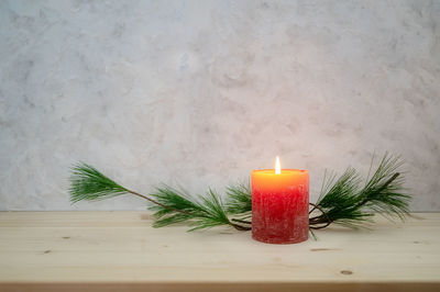 High angle view of illuminated candles on table