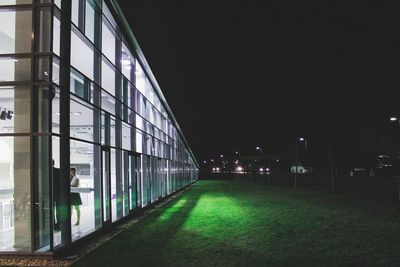 Illuminated building against sky at night