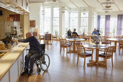 Senior man having coffee in dining room