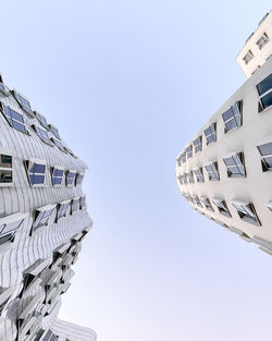 Low angle view of skyscraper against clear sky