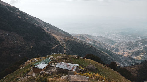 High angle view of buildings and mountains against sky