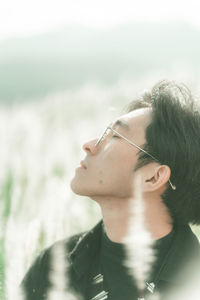 Portrait of man standing in the middle of white reeds