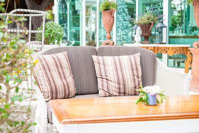 Flower pots on table at home